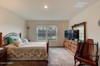 Discover this stunning lake-view home on a spacious corner lot! on Grand Reserve Golf Course in Florida - for sale on GolfHomes.com, golf home, golf lot