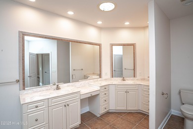 Gorgeous custom brick home sitting on a private .48/acre cul de on Ocean Ridge Plantation in North Carolina - for sale on GolfHomes.com, golf home, golf lot