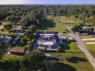 Prepare to be wowed by this magnificent 2-story home on an on Okeeheelee Golf Course in Florida - for sale on GolfHomes.com, golf home, golf lot