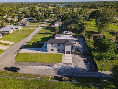 Prepare to be wowed by this magnificent 2-story home on an on Okeeheelee Golf Course in Florida - for sale on GolfHomes.com, golf home, golf lot