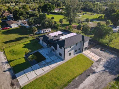 Prepare to be wowed by this magnificent 2-story home on an on Okeeheelee Golf Course in Florida - for sale on GolfHomes.com, golf home, golf lot