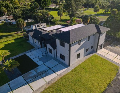 Prepare to be wowed by this magnificent 2-story home on an on Okeeheelee Golf Course in Florida - for sale on GolfHomes.com, golf home, golf lot