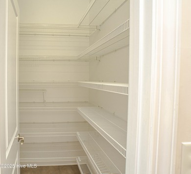 Gorgeous custom brick home sitting on a private .48/acre cul de on Ocean Ridge Plantation in North Carolina - for sale on GolfHomes.com, golf home, golf lot