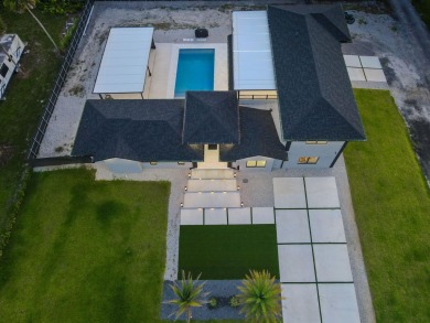 Prepare to be wowed by this magnificent 2-story home on an on Okeeheelee Golf Course in Florida - for sale on GolfHomes.com, golf home, golf lot