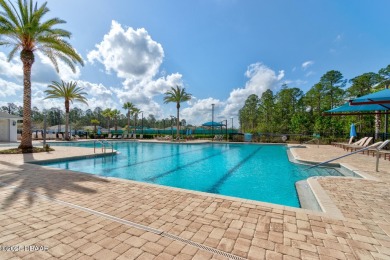 Discover this stunning lake-view home on a spacious corner lot! on Grand Reserve Golf Course in Florida - for sale on GolfHomes.com, golf home, golf lot