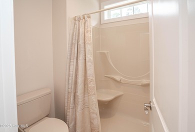 Gorgeous custom brick home sitting on a private .48/acre cul de on Ocean Ridge Plantation in North Carolina - for sale on GolfHomes.com, golf home, golf lot