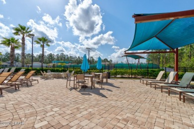 Discover this stunning lake-view home on a spacious corner lot! on Grand Reserve Golf Course in Florida - for sale on GolfHomes.com, golf home, golf lot