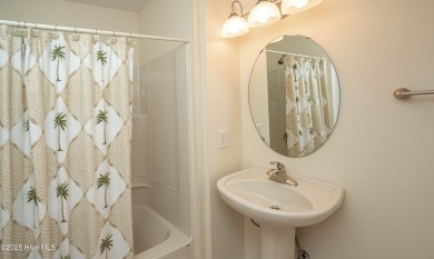 Gorgeous custom brick home sitting on a private .48/acre cul de on Ocean Ridge Plantation in North Carolina - for sale on GolfHomes.com, golf home, golf lot