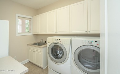 Gorgeous custom brick home sitting on a private .48/acre cul de on Ocean Ridge Plantation in North Carolina - for sale on GolfHomes.com, golf home, golf lot