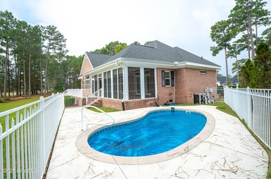 Gorgeous custom brick home sitting on a private .48/acre cul de on Ocean Ridge Plantation in North Carolina - for sale on GolfHomes.com, golf home, golf lot