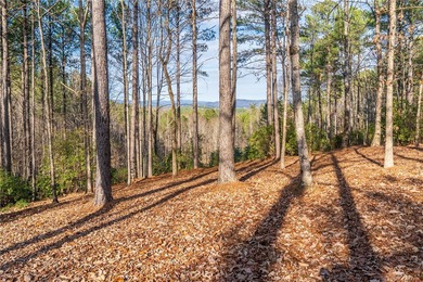 Beautifully wooded lot with gentle build site and some long on The Cliffs At Keowee Falls in South Carolina - for sale on GolfHomes.com, golf home, golf lot