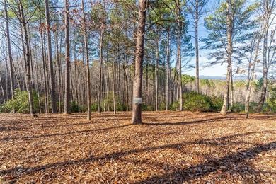 Beautifully wooded lot with gentle build site and some long on The Cliffs At Keowee Falls in South Carolina - for sale on GolfHomes.com, golf home, golf lot