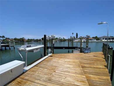 Welcome to Vina Del Mar!  This 4BR/2BA Waterfront Home is only 1 on Isla Del Sol Yacht and Country Club in Florida - for sale on GolfHomes.com, golf home, golf lot