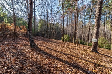 Beautifully wooded lot with gentle build site and some long on The Cliffs At Keowee Falls in South Carolina - for sale on GolfHomes.com, golf home, golf lot