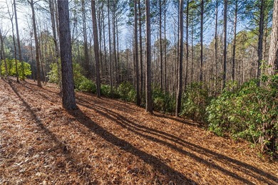 Beautifully wooded lot with gentle build site and some long on The Cliffs At Keowee Falls in South Carolina - for sale on GolfHomes.com, golf home, golf lot
