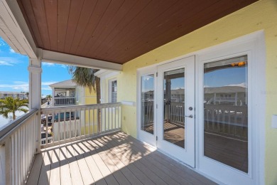 Sporting pastel-colored, Bermuda-styled exteriors, this on St. Petersburg Country Club in Florida - for sale on GolfHomes.com, golf home, golf lot