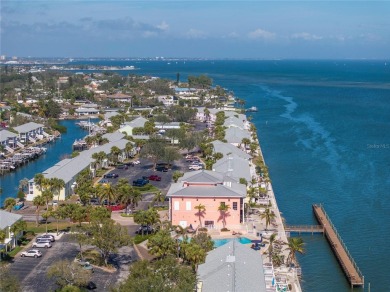 Sporting pastel-colored, Bermuda-styled exteriors, this on St. Petersburg Country Club in Florida - for sale on GolfHomes.com, golf home, golf lot