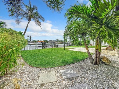 Welcome to Vina Del Mar!  This 4BR/2BA Waterfront Home is only 1 on Isla Del Sol Yacht and Country Club in Florida - for sale on GolfHomes.com, golf home, golf lot