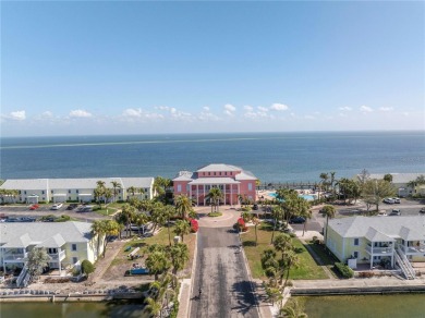 Sporting pastel-colored, Bermuda-styled exteriors, this on St. Petersburg Country Club in Florida - for sale on GolfHomes.com, golf home, golf lot
