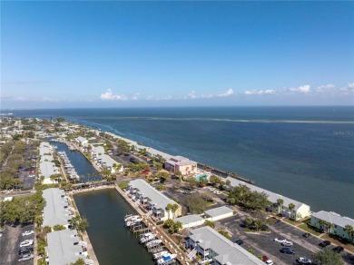 Sporting pastel-colored, Bermuda-styled exteriors, this on St. Petersburg Country Club in Florida - for sale on GolfHomes.com, golf home, golf lot