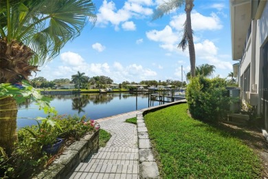 LUXURY WATERFRONT LIVING ON A WIDE, DEEP, SAILBOAT CANAL LEADING on Mangrove Bay Golf Course in Florida - for sale on GolfHomes.com, golf home, golf lot