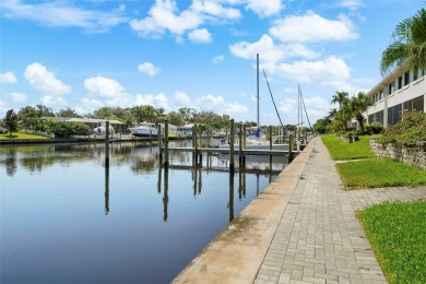 LUXURY WATERFRONT LIVING ON A WIDE, DEEP, SAILBOAT CANAL LEADING on Mangrove Bay Golf Course in Florida - for sale on GolfHomes.com, golf home, golf lot