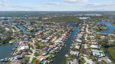 LUXURY WATERFRONT LIVING ON A WIDE, DEEP, SAILBOAT CANAL LEADING on Mangrove Bay Golf Course in Florida - for sale on GolfHomes.com, golf home, golf lot