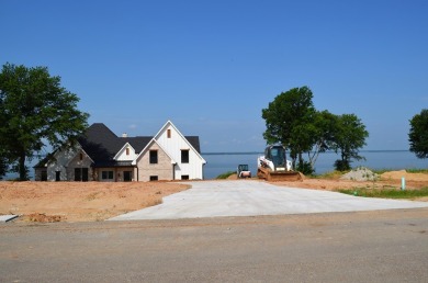 Beautiful sunsets and open water views from this corner lot on Cedar Creek Country Club in Texas - for sale on GolfHomes.com, golf home, golf lot