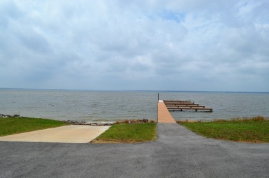 Beautiful sunsets and open water views from this corner lot on Cedar Creek Country Club in Texas - for sale on GolfHomes.com, golf home, golf lot