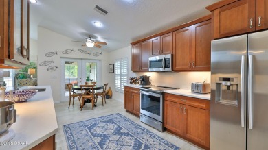 This beautifully updated 3-bedroom 2-bath pool home shows like on Plantation Bay Golf and Country Club in Florida - for sale on GolfHomes.com, golf home, golf lot