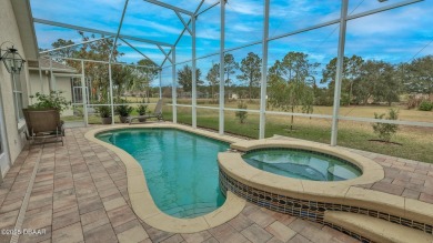 This beautifully updated 3-bedroom 2-bath pool home shows like on Plantation Bay Golf and Country Club in Florida - for sale on GolfHomes.com, golf home, golf lot