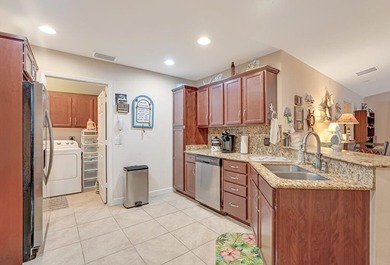 Welcome to this charming home in Spanish Lakes One, one of Port on Spanish Lakes I in Florida - for sale on GolfHomes.com, golf home, golf lot