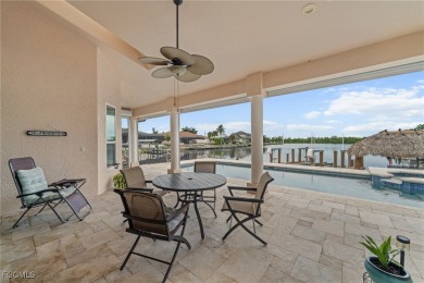 NEVER FLOODED ON THE INSIDE! LOW FLOOD INSURANCE COSTS! This on Royal Tee Country Club in Florida - for sale on GolfHomes.com, golf home, golf lot