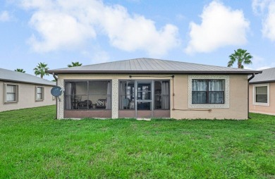 This charming home is located in the highly sought-after Spanish on Spanish Lakes I in Florida - for sale on GolfHomes.com, golf home, golf lot