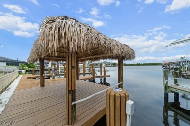 NEVER FLOODED ON THE INSIDE! LOW FLOOD INSURANCE COSTS! This on Royal Tee Country Club in Florida - for sale on GolfHomes.com, golf home, golf lot