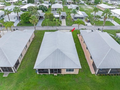 This charming home is located in the highly sought-after Spanish on Spanish Lakes I in Florida - for sale on GolfHomes.com, golf home, golf lot