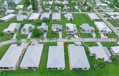 This charming home is located in the highly sought-after Spanish on Spanish Lakes I in Florida - for sale on GolfHomes.com, golf home, golf lot