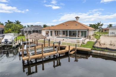NEVER FLOODED ON THE INSIDE! LOW FLOOD INSURANCE COSTS! This on Royal Tee Country Club in Florida - for sale on GolfHomes.com, golf home, golf lot