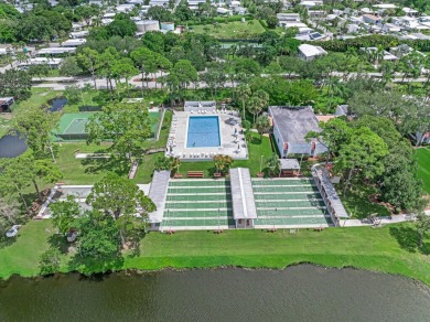 This charming home is located in the highly sought-after Spanish on Spanish Lakes I in Florida - for sale on GolfHomes.com, golf home, golf lot