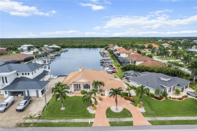 NEVER FLOODED ON THE INSIDE! LOW FLOOD INSURANCE COSTS! This on Royal Tee Country Club in Florida - for sale on GolfHomes.com, golf home, golf lot