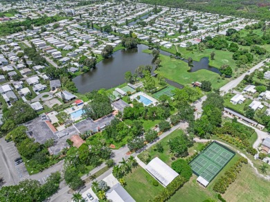 This charming home is located in the highly sought-after Spanish on Spanish Lakes I in Florida - for sale on GolfHomes.com, golf home, golf lot