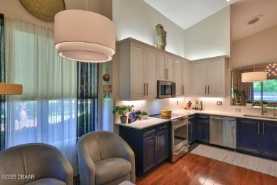 Rarely available one story end unit w/lake and fountain view in on Plantation Bay Golf and Country Club in Florida - for sale on GolfHomes.com, golf home, golf lot