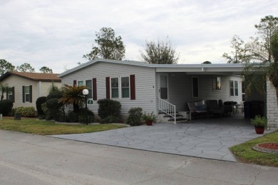 Beautiful 2-Bedroom Palm Harbor Home with Stunning Golf Course on Schalamar Creek Golf and Country Club in Florida - for sale on GolfHomes.com, golf home, golf lot