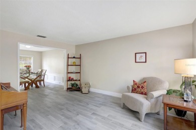 Welcome to this lovingly maintained 4-bedroom, 2.5-bath home on Hunters Green Country Club in Florida - for sale on GolfHomes.com, golf home, golf lot