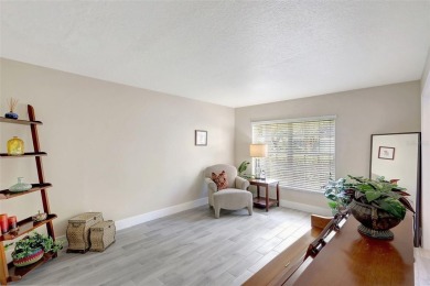 Welcome to this lovingly maintained 4-bedroom, 2.5-bath home on Hunters Green Country Club in Florida - for sale on GolfHomes.com, golf home, golf lot