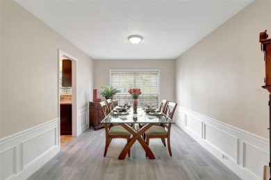 Welcome to this lovingly maintained 4-bedroom, 2.5-bath home on Hunters Green Country Club in Florida - for sale on GolfHomes.com, golf home, golf lot