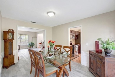 Welcome to this lovingly maintained 4-bedroom, 2.5-bath home on Hunters Green Country Club in Florida - for sale on GolfHomes.com, golf home, golf lot
