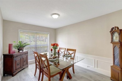 Welcome to this lovingly maintained 4-bedroom, 2.5-bath home on Hunters Green Country Club in Florida - for sale on GolfHomes.com, golf home, golf lot