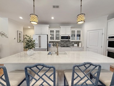 Lowcountry cottage living in the heart of Murrells Inlet on TPC Myrtle Beach Golf Club in South Carolina - for sale on GolfHomes.com, golf home, golf lot