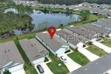 This MOVE- IN READY, LIKE NEW, WATERFRONT home, built in 2022 is on Grand Reserve Golf Course in Florida - for sale on GolfHomes.com, golf home, golf lot